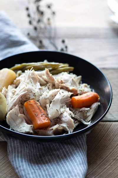Lemon-Herb Slow Cooker Whole Chicken is an easy "set it and forget it" meal. A few minutes of prep time is all you need for a flavor-packed dinner! SavorySimple.net