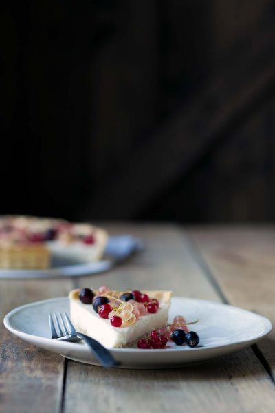 This Mixed Currant Panna Cotta Tart is a light, beautiful dessert that will wow your guests! SavorySimple.net