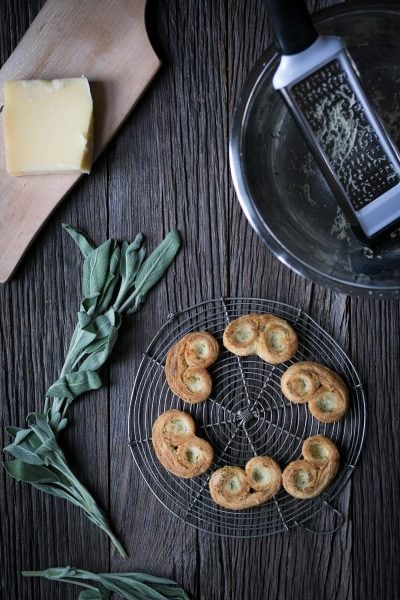 Savory Palmiers with Cheese and Herbs are perfect party food! Prepare them in advance and serve at room temperature with wine or cocktails.