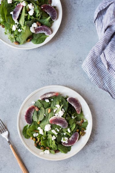 overhead image: 2 plates of spring mix salad