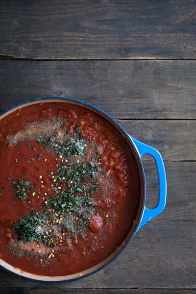 A photo of tomato sauce is a dutch oven.