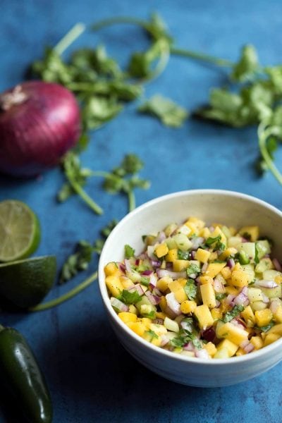 This mango salsa is fantastic serving with tortilla chips, but I also love using it as a topping for fish and chicken!