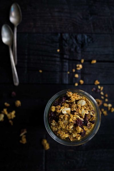 Pumpkin Granola with Pecans and Cranberries is perfect as a breakfast or snack. It’s full of healthy ingredients, with just a hint of sweetness from maple syrup.