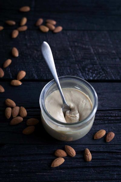 A photo of this homemade almond butter recipe in a mason jar.