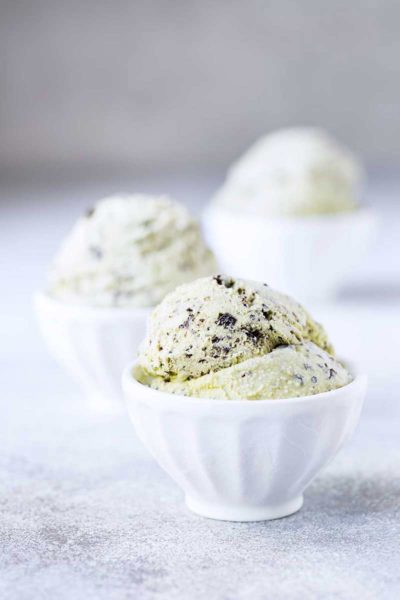 Three bowls of homemade mint chocolate chip ice cream