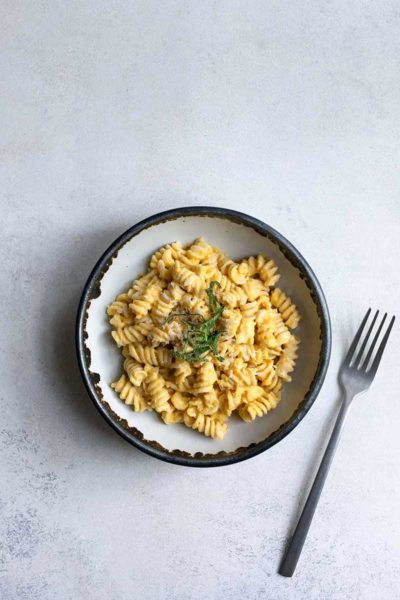 Creamy, homemade butternut squash pasta with sage in a bowl