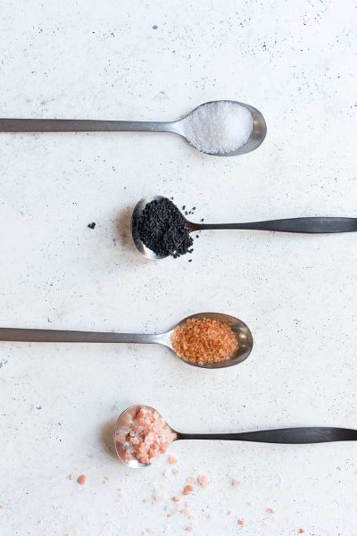 Assorted types of salt on spoons