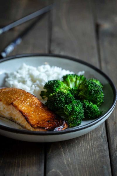 Miso salmon recipe on plate with rice and broccoli