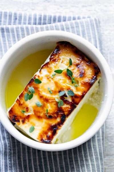 baked feta in a ramekin with honey and thyme