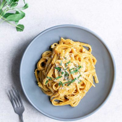 overhead image: plated dinner of pasta with pumpkin sauce