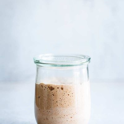 Active sourdough starter in a large mason jar