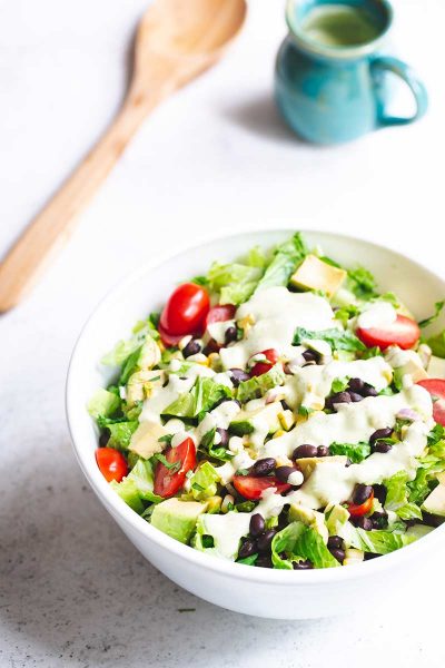 Mexican chopped salad topped with salad dressing